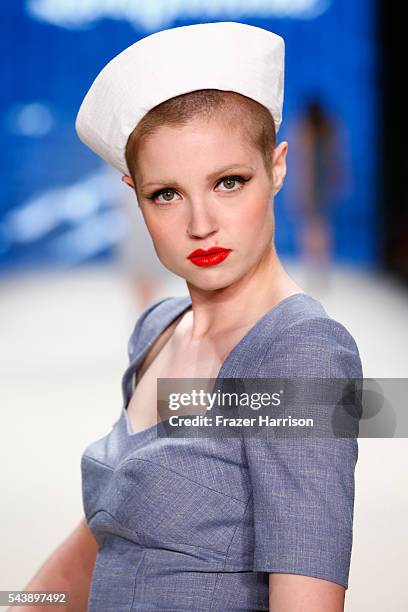 Model walks the runway at the Lena Hoschek show during the Mercedes-Benz Fashion Week Berlin Spring/Summer 2017 at Erika Hess Eisstadion on June 30,...