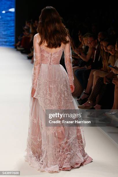 Model walks the runway at the Lena Hoschek show during the Mercedes-Benz Fashion Week Berlin Spring/Summer 2017 at Erika Hess Eisstadion on June 30,...