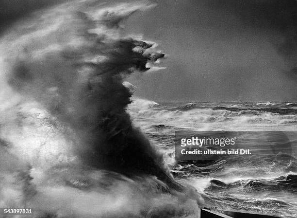 Surging billow during a storm over the North Sea at the levee of Helgoland, Germany - 1936 - Photographer: Franz Schensky - Published by: 'Die...