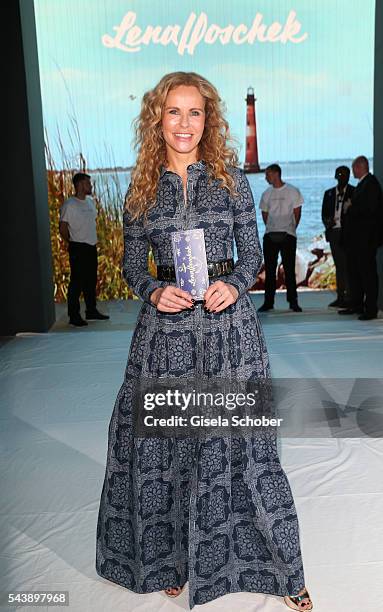 Katja Burkard, wearing a blue dress by Lena Hoschek during the Lena Hoschek show during the Mercedes-Benz Fashion Week Berlin Spring/Summer 2017 at...