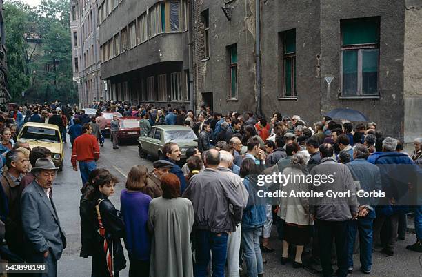 People line up to get their share of rationed food during the siege of Sarajevo in the Yugoslavian Civil War. The siege of the city continued until a...