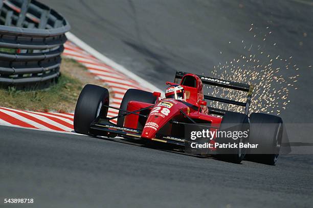 Sparks fly off the Ferrari Formula One racecar driven by Jean Alesi during the Belgian Grand Prix.