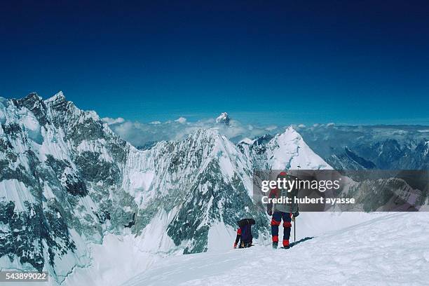 Mountaineers Hubert Ayasse and Gilbert Burzicchi are just 35 metres from the summit, but decide to descent to avoid Ayasse's fingers from freezing...