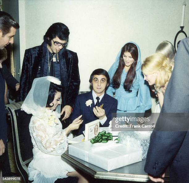 American rock legend Elvis Presley and his wife Priscilla attend George Klein's wedding with Barbara Little in Elvis' International Hotel Suite.