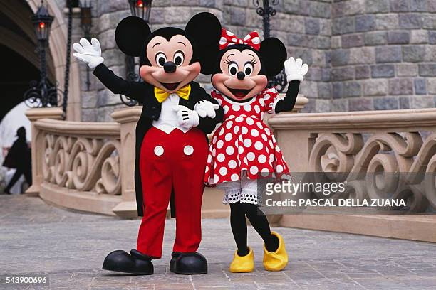 Characters Mickey and Minnie Mouse in the streets of Disneyland Paris Resort.