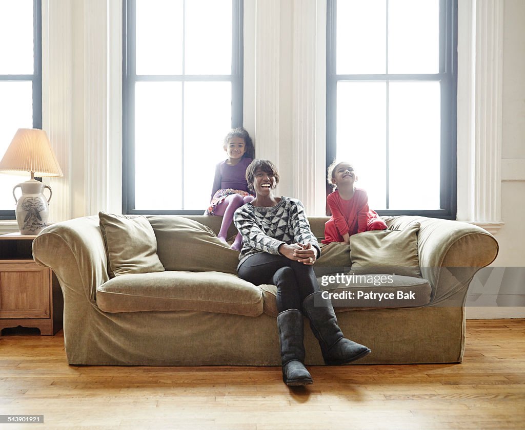 Mom with two daughters goofing around