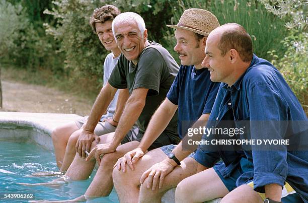 French actors Marc Lavoine, Gerard Darmon, Jean-Pierre Darroussin, and Bernard Campan on the set of the film Le Coeur des Hommes , directed by Marc...