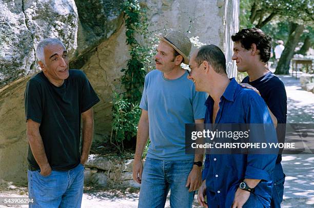 French actors Gerard Darmon, Jean-Pierre Darroussin, Marc Lavoine, and Bernard Campan on the set of the film Le Coeur des Hommes , directed by Marc...