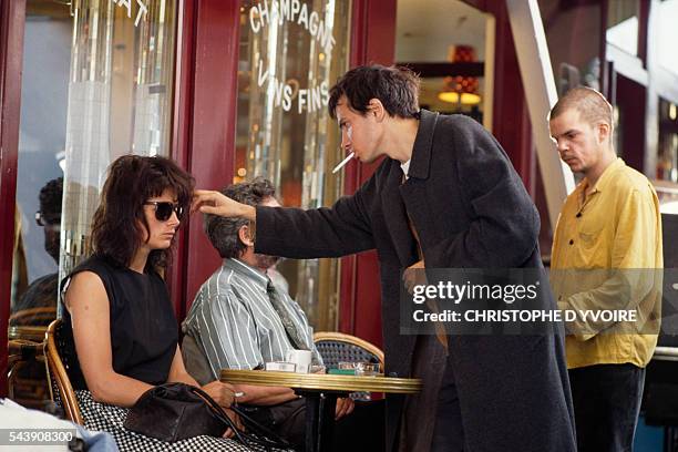 French actress Juliette Binoche, director Leox Carax, and actor Denis Lavant on the set of Carax's film Les Amants du Pont Neuf .