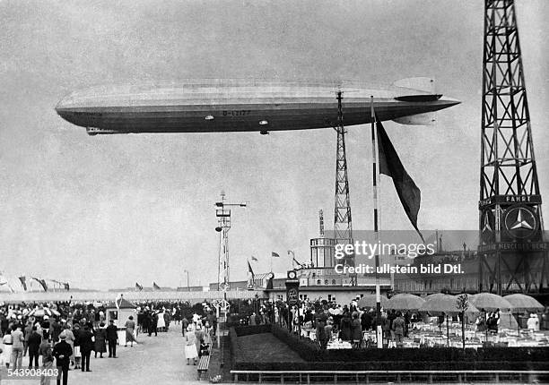 German Empire Free State Prussia Brandenburg Province Berlin: Zeppelin flying over Tempelhof - Photographer: Atelier Balassa- Published by: 'Berliner...