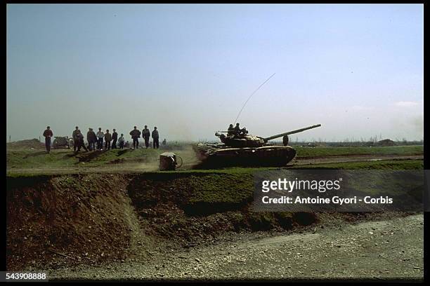 An Omon unit patrols in a Chechen village.
