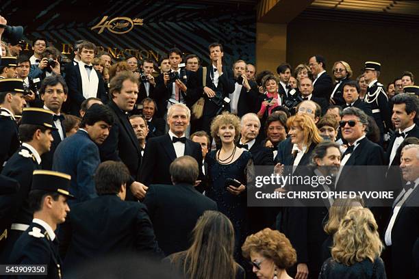 American actors and husband and wife Paul Newman and Joanne Woodward attend the Cannes Film Festival for the presentation of Newman's film The Glass...