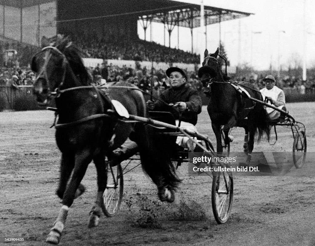 German Empire Free State Prussia Brandenburg Province Berlin: Harness racing track Mariendorf - ' Xijra ' (Froemming) in front of ' Anmut ' (Ch. Mills) during the Buddenbrock Race - Photographer: Hans Henschke- Published by: 'B.Z.' 18.04.1933Vintage 