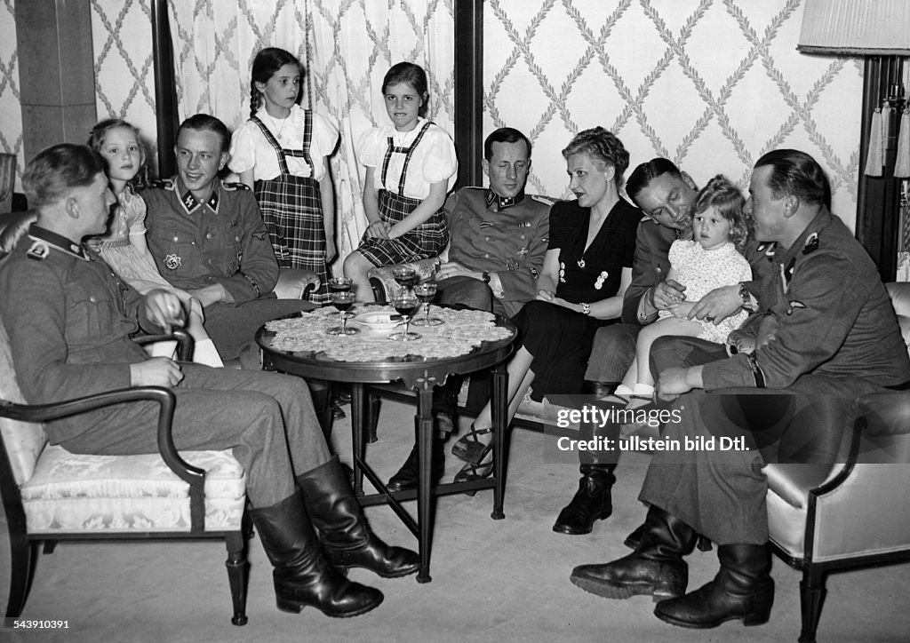 Goebbels, Magda - Wife of J. Goebbels, GermanyWith her daughters at a reception for SS-soldiers who took part in the conquering of the city of Charkiv - 1943- Photographer: Presse-Illustrationen Heinrich Hoffmann- Published by: 'Signal' 11/1943Vintag