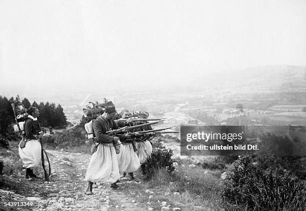 French infantrymen in Algeria pointing their muskets towards a valley - 1903- Photographer: Chusseau-Flaviens- Published by: 'Berliner Illustrirte...