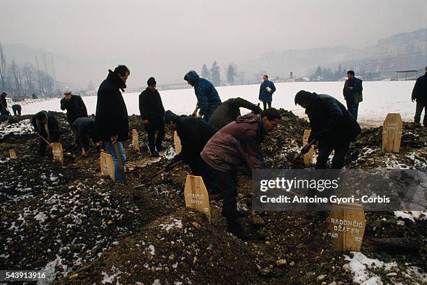 Gravedigger buries the bodies of civilians killed during the siege of Sarajevo in the Yugoslavian Civil War. In March of 1992, Bosnia and Herzegovina...