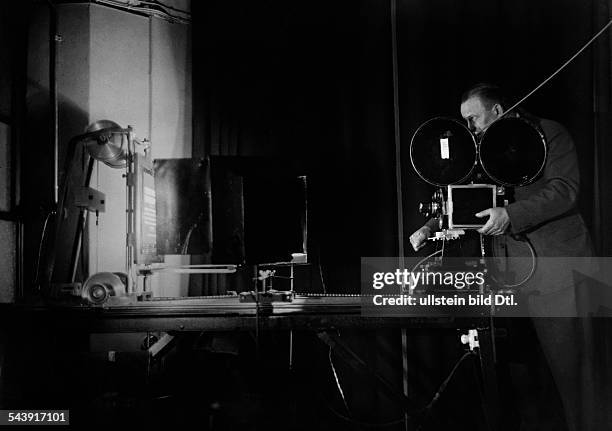 German Empire Free State Prussia Brandenburg Province Berlin: Production of the German newsreel ' Wochenschau ' for German Cinemas - man is filming...