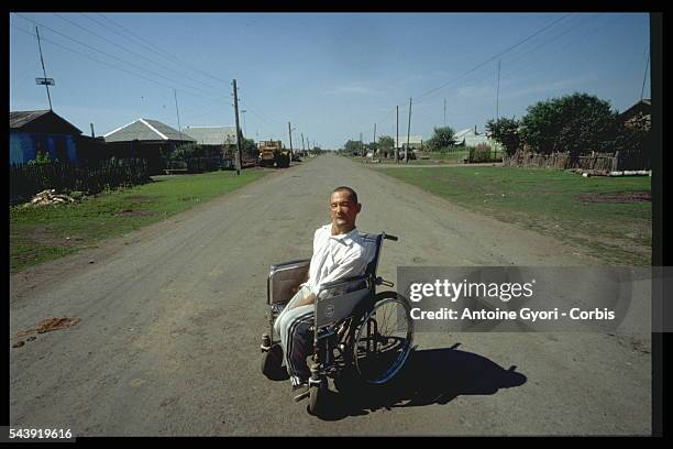 Mental defective in a street in Muslumovo village.