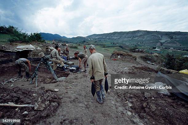 Russian artillery positions face the Tchabanhakhi hills, held by Chechen rebels.