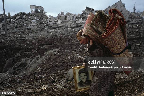 The last of the Chechen civilians from Grozny flee the town, taking their belongings with them.