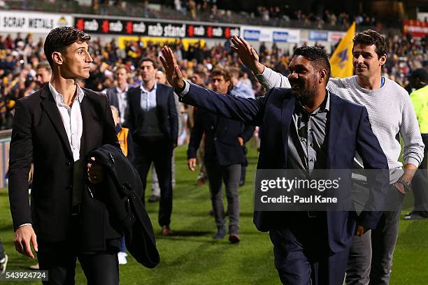 Tyson Stenglein, David Wirrpanda and Andrew Embley walk a lap of honour with team mates celebrating the West Coast Eagles 2006 Premiership...