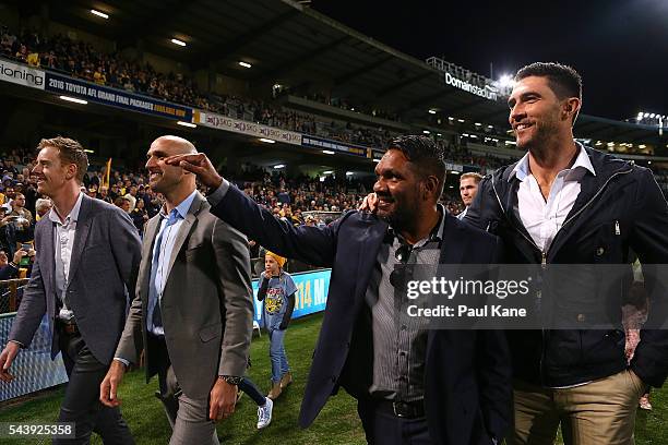 Ashley Hansen, Chris Judd, David Wirrpanda and Brent Staker walk a lap of honour with team mates celebrating the West Coast Eagles 2006 Premiership...