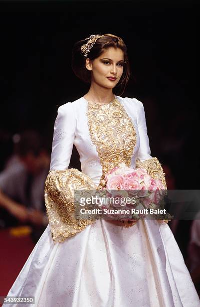 French model and actress Laetitia Casta on the runway for the Fall-Winter 1995-1996 Haute Couture fashion show for Ted Lapidus.
