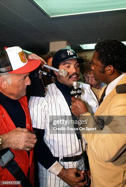 Reggie Jackson of the New York Yankees celebrates and talks with the media after they defeated the Los Angeles Dodgers in Game 6 of the 1977 World...