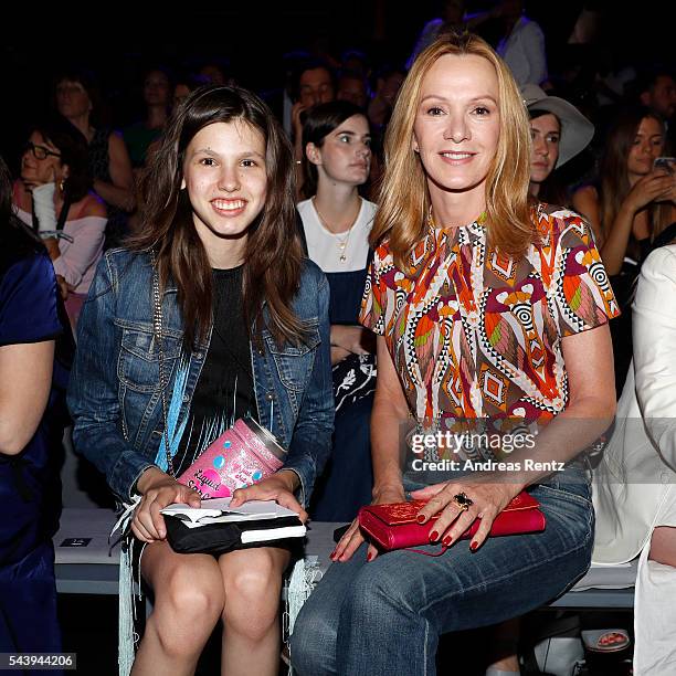 Katja Flint , dressed by Peek & Cloppenburg, and her daughter Lisa attend the 'Designer for Tomorrow' show during the Mercedes-Benz Fashion Week...