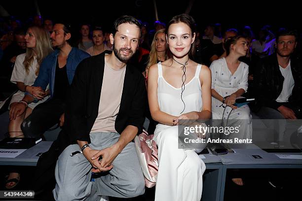 Emilia Schuele , dressed by Peek & Cloppenburg, and Franz Dinda attend the 'Designer for Tomorrow' show during the Mercedes-Benz Fashion Week Berlin...