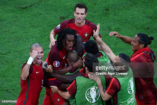 Renato Sanches of Portugal celebrates scoring his team's first goal with his team mates during the UEFA EURO 2016 quarter final match between Poland...