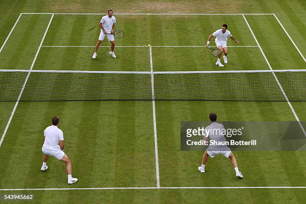 Jamie Murray of Great Britain and Bruno Soares of Brazil in action during the Men's doubles first round match against Jonathan Erlich of Israel and...