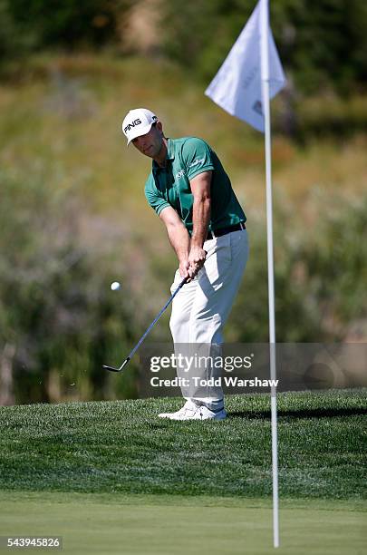 Luke Guthrie chips onto the first green during the first round of the Barracuda Championship at the Montreux Golf and Country Club on June 30, 2016...