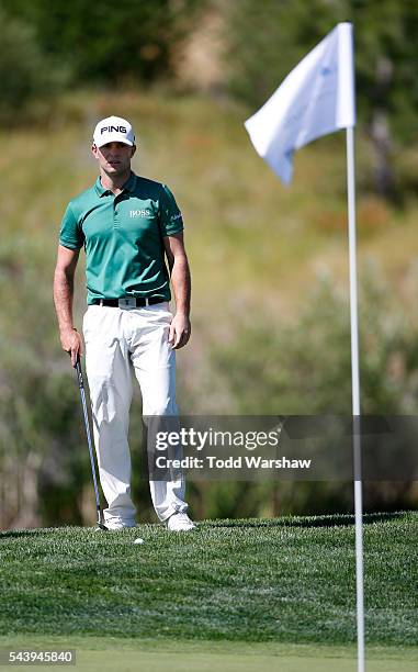 Luke Guthrie chips onto the first green during the first round of the Barracuda Championship at the Montreux Golf and Country Club on June 30, 2016...