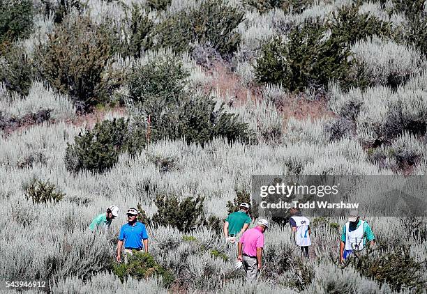 Billy Mayfair; Charlie Wi of Korea and Luke Guthrie search for two of their balls along the first fairway during the first round of the Barracuda...