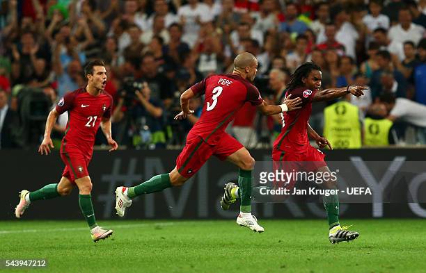 Renato Sanches of Portugal celebrates scoring his team's first goal with his team mate Pepe and Cedric Soares during the UEFA EURO 2016 quarter final...
