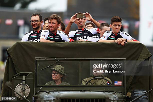 The Bora-Argon 18 team join the Team Presentation parade ahead of the 2016 Tour de France at on June 30, 2016 in Sainte-Mere-Eglise, France.