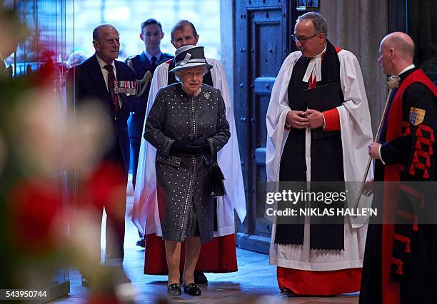 The Dean of Westminster, Very Reverend Dr John Hall , Britain's Queen Elizabeth II and Britain's Prince Philip, Duke of Edinburgh arrive to attend a...