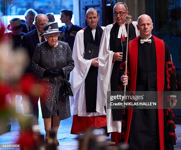 The Dean of Westminster, Very Reverend Dr John Hall , Britain's Queen Elizabeth II and Britain's Prince Philip, Duke of Edinburgh arrive to attend a...