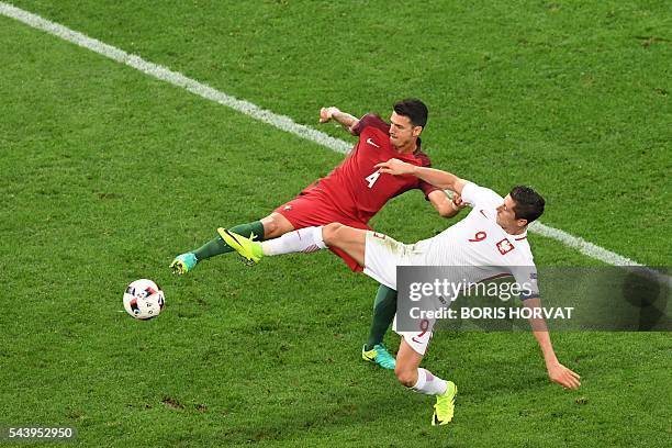 Portugal's defender Fonte vies with Poland's forward Robert Lewandowski during the Euro 2016 quarter-final football match between Poland and Portugal...