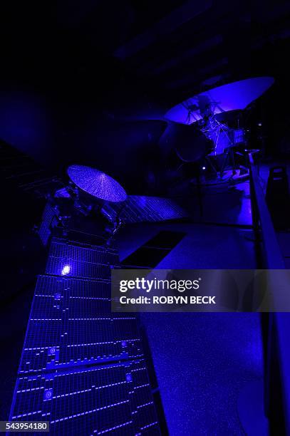 Scale model of NASA's Juno Spacecraft is seen in the foreground while a model of the 1977 Voyager spacecraft is seen in the background, at the Jet...