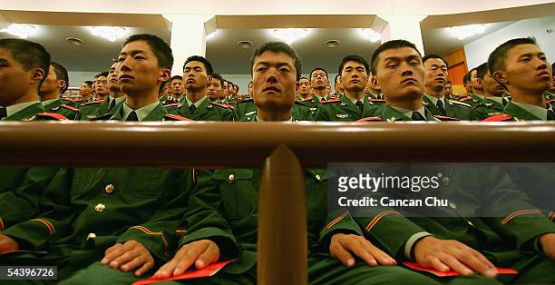 Chinese soldiers attend a meeting marking the 60th anniversary of the victory of China's Resistance War Against Japanese Aggression on September 3,...