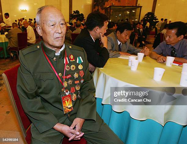 Veteran Wang Wei waits for a meeting marking the 60th anniversary of the victory of China's Resistance War Against Japanese Aggression on September...