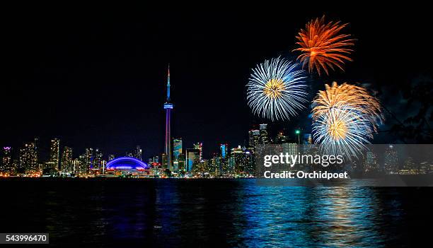 toronto harbourfront fireworks - cn tower and fireworks stock pictures, royalty-free photos & images