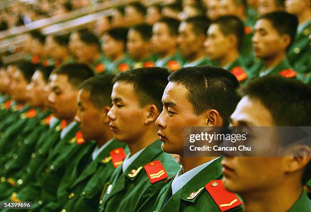 Chinese soldiers attend a meeting marking the 60th anniversary of the victory of China's Resistance War Against Japanese Aggression September 3, 2005...