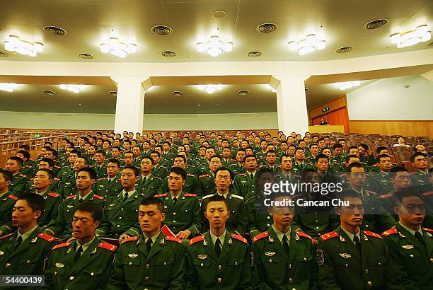 Chinese soldiers attend a meeting marking the 60th anniversary of the victory of China's Resistance War Against Japanese Aggression September 3, 2005...