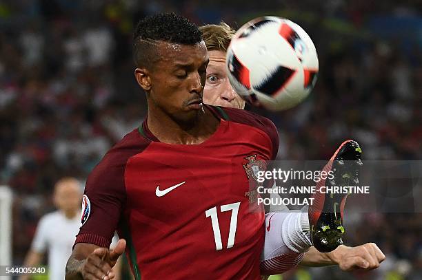 Portugal's forward Nani vies for the ball with Poland's midfielder Jakub Blaszczykowski during the Euro 2016 quarter-final football match between...