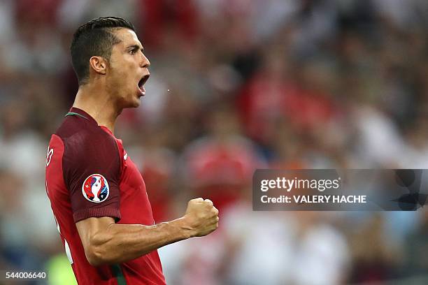 Portugal's forward Cristiano Ronaldo celebrates after scoring a penalty during the Euro 2016 quarter-final football match between Poland and Portugal...