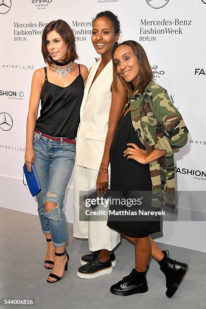 Lena Meyer-Landrut, Sara Nuru, dressed by Peek & Cloppenburg, and Hadnet Tesfai attend the 'Designer for Tomorrow' show during the Mercedes-Benz...