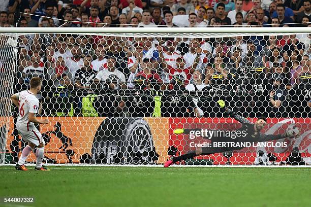 Poland's midfielder Jakub Blaszczykowski misses a shot in a penalty shoot-out during the Euro 2016 quarter-final football match between Poland and...